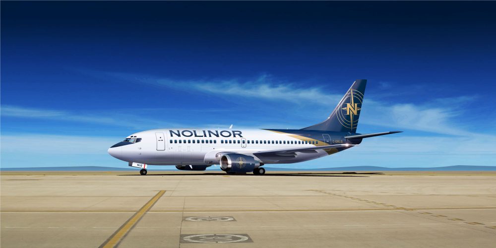 A Noliner aircraft is parked on a runway under a clear blue sky, showcasing its distinctive branding and design.