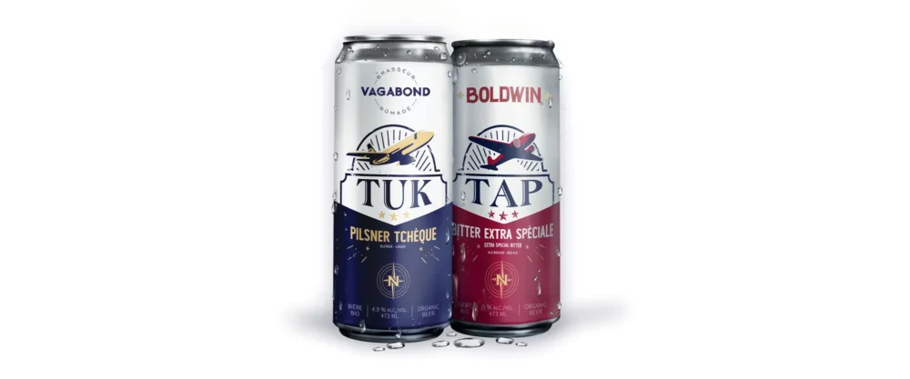 Two beer cans side by side: TUK Pilsner with a blue design and Boldwin Bitter Extra Spéciale with a red design, both featuring nautical themes.